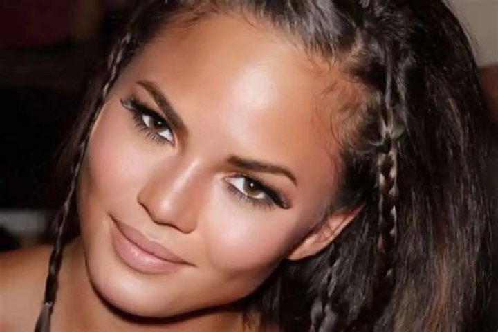 Chrissy Teigen Goes Viral For Cooking In A Montce Swim Two-Piece Bathing Suit