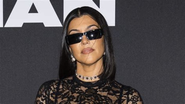 Kourtney Kardashian Sizzles In Red Lips, Curlers, And Skims