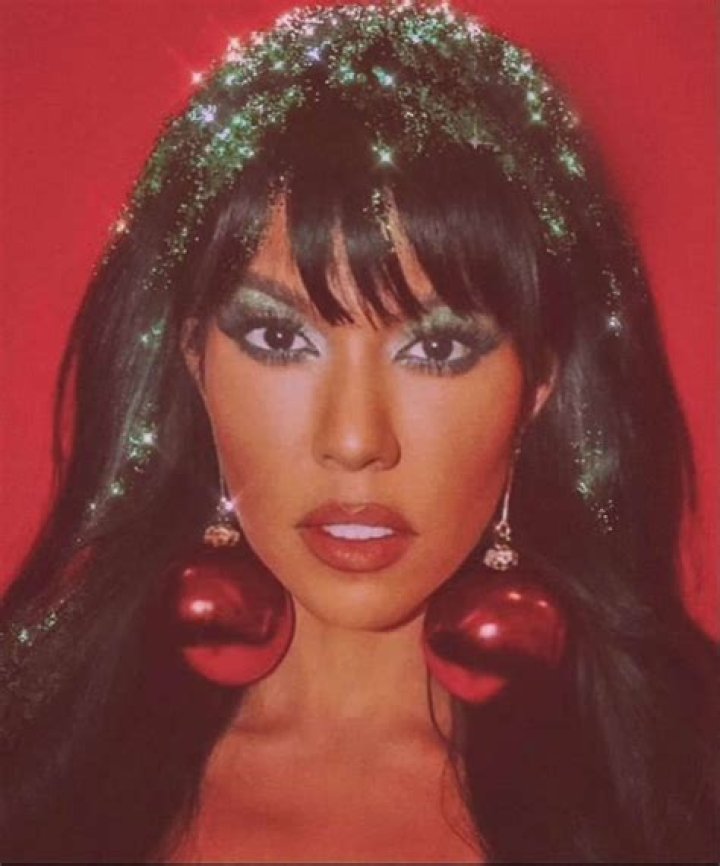 Kourtney Kardashian Wears Skimpy Christmas Mini Dress And Says She Is The Present — Khloe Kardashian Responds