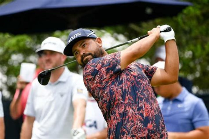 Who is J. J. Spaun's father John Spaun?